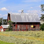 Old barn with gas barrel smiley face